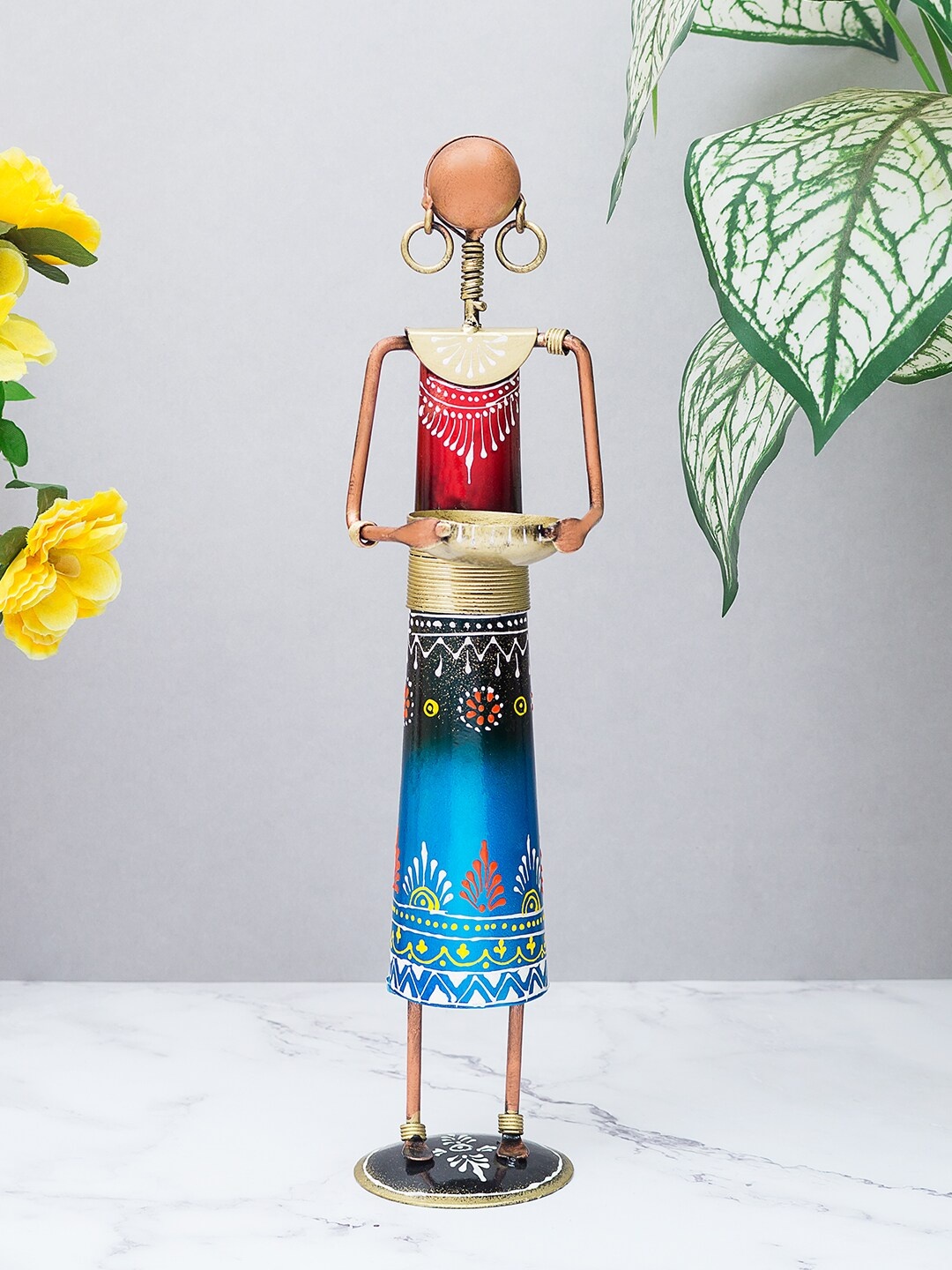 

Golden Peacock Blue & Red Metal Rajasthani Working Lady Figurine Showpiece