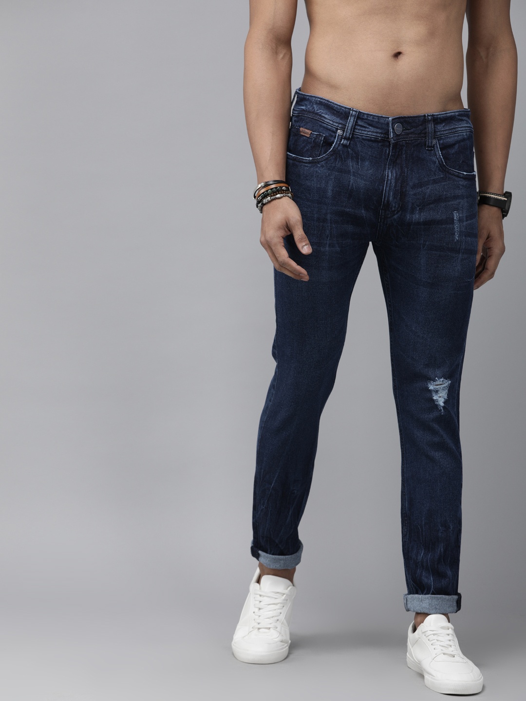 

The Roadster Lifestyle Co Men Blue Ankle Skinny Fit Mid-Rise Low Distress Stretchable Jeans