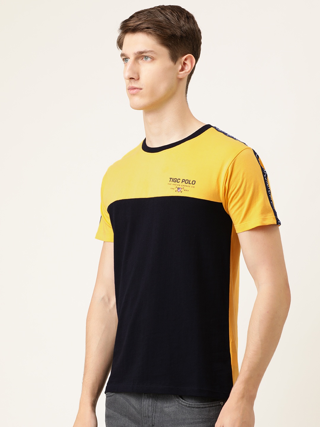 

The Indian Garage Co Men Black Yellow Colourblocked Round Neck Pure Cotton T-shirt