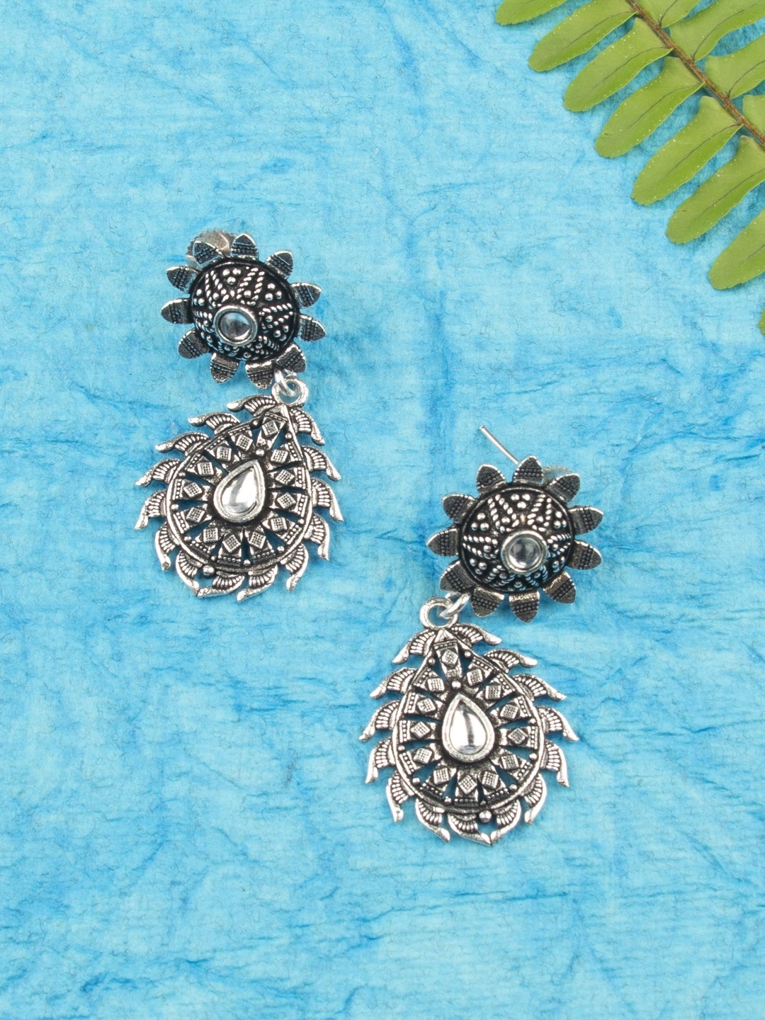 

AccessHer Oxidized Silver-Plated Kundan Studded Teardrop Shaped Drop Earrings