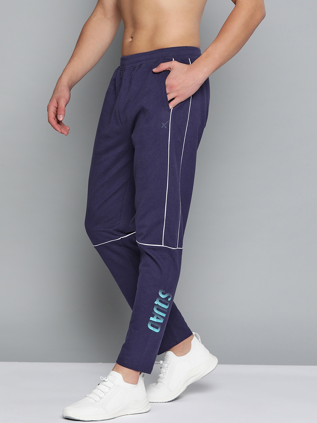 

HRX By Hrithik Roshan Men Medival Blue Typographic Regular Fit Mid-Rise Bio-Wash Lifestyle Track Pants, Navy blue