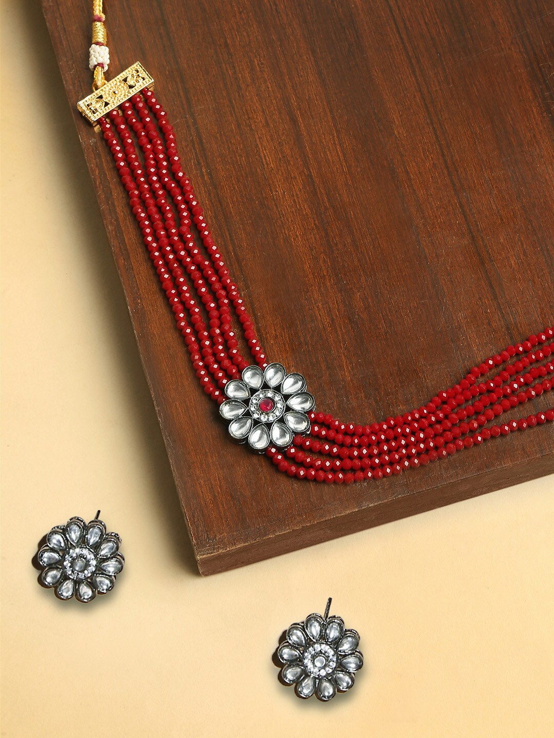 

OOMPH Silver-Plated Red Beaded Floral-Shaped Kundan-Studded Multi-Stranded Jewellery Set