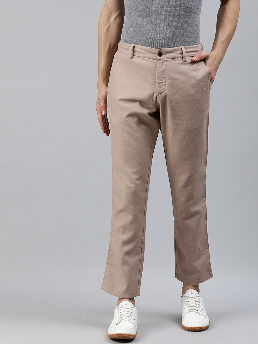 

Arrow New York Men Beige Tapered Fit Solid Regular Trousers