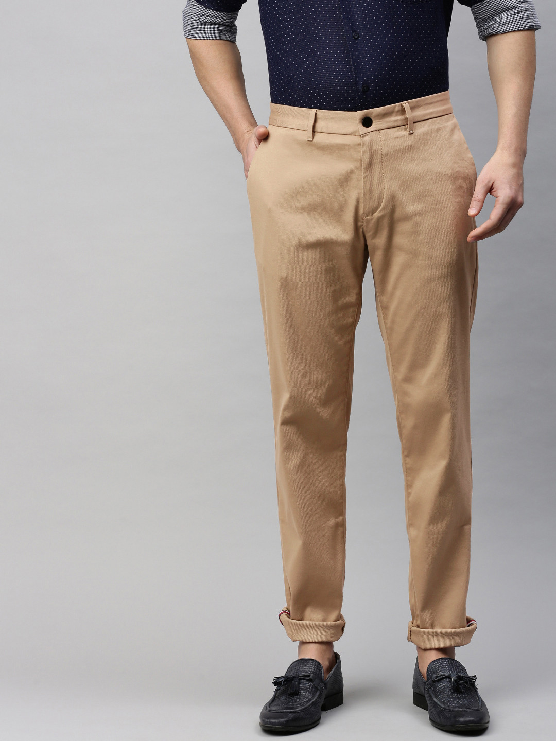 

Tommy Hilfiger Men Beige Slim Fit Solid Regular Trousers