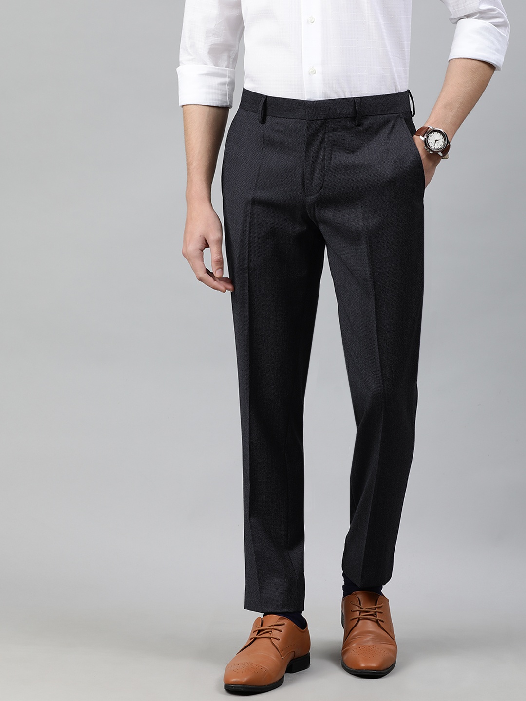 

Tommy Hilfiger Men Black Slim Fit Solid Regular Trousers