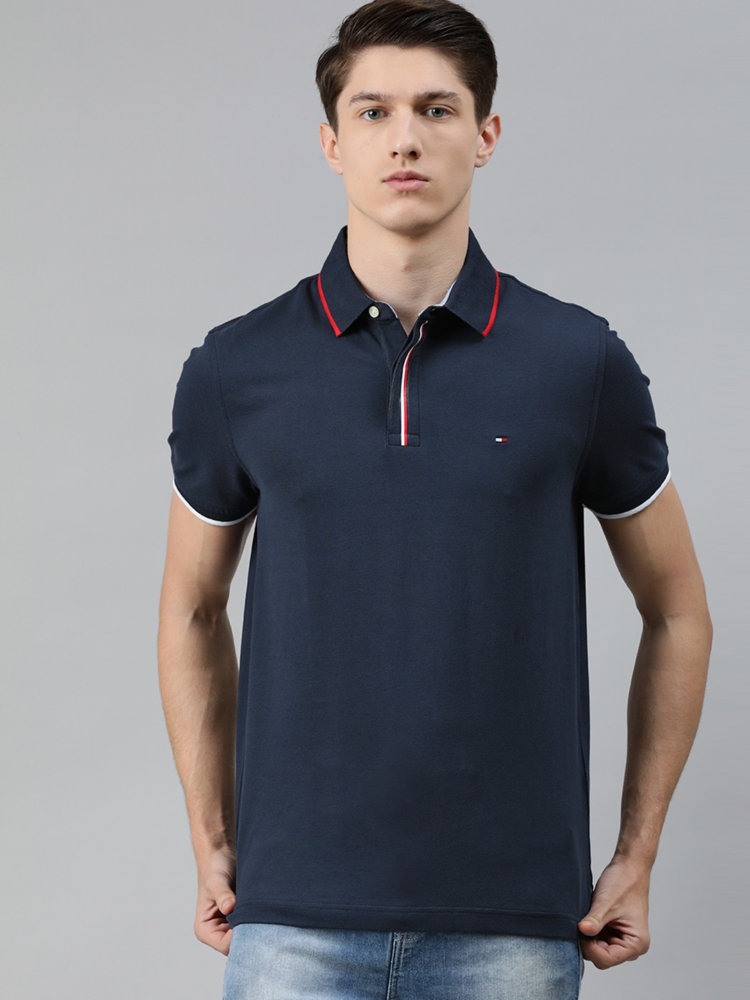 

Tommy Hilfiger Men Navy Blue Solid Polo Collar T-shirt