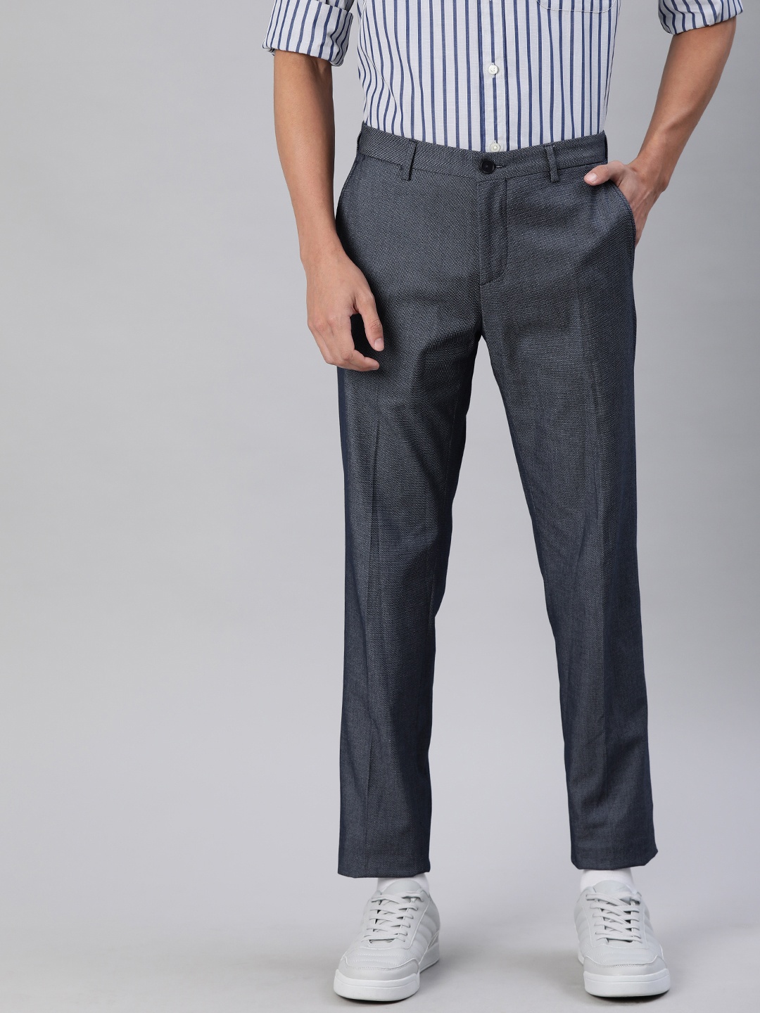 

Tommy Hilfiger Men Navy Blue Slim Fit Solid Regular Trousers