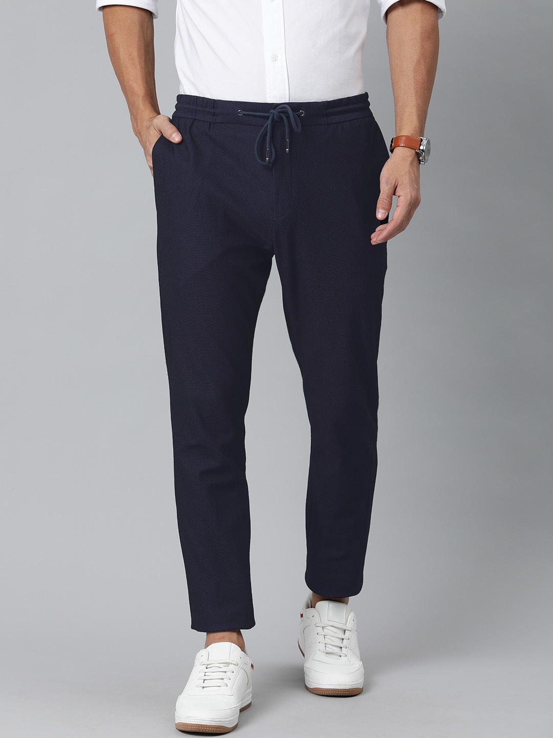 

Tommy Hilfiger Men Navy Blue Slim Fit Solid Regular Trousers