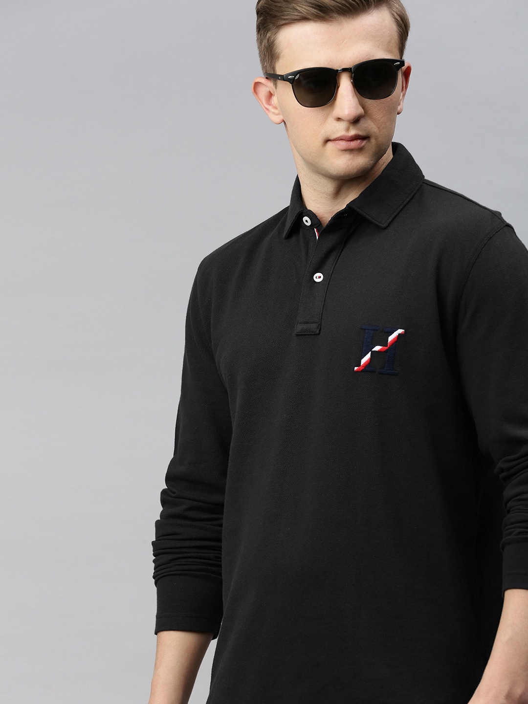 

Tommy Hilfiger Men Black Solid Polo Collar T-shirt