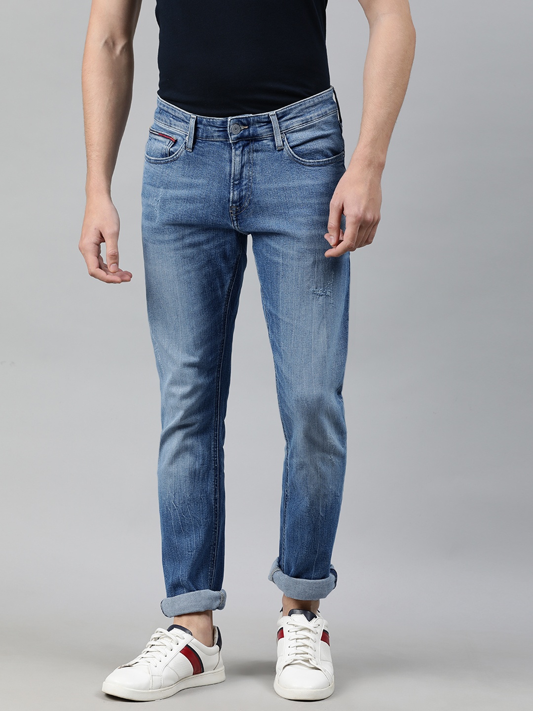 

Tommy Hilfiger Men Blue Slim Fit Mid-Rise Low Distress Jeans