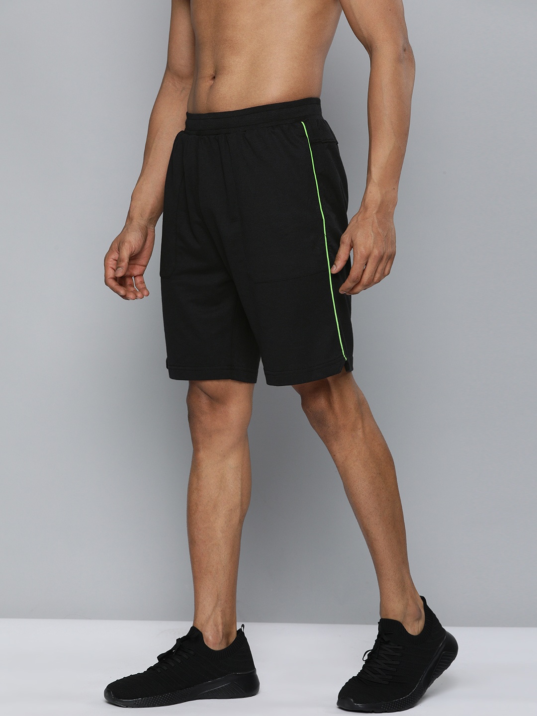 

HRX By Hrithik Roshan Men Black Solid Regular Fit Mid-Rise Bio-Wash Lifestyle Shorts