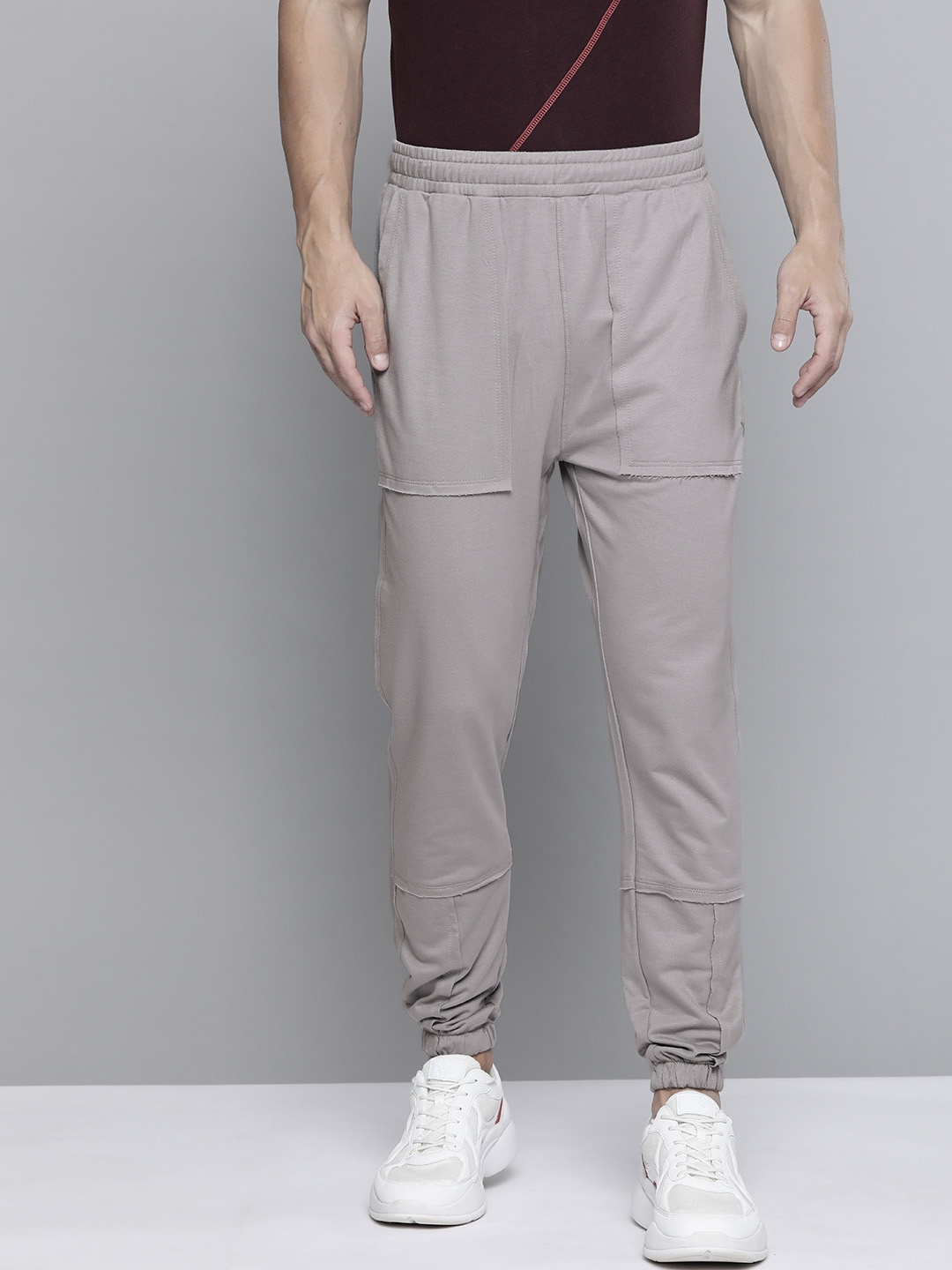 

HRX By Hrithik Roshan Men Wet Weather Solid Slim Fit Mid-Rise Bio-Wash Lifestyle Joggers, Grey