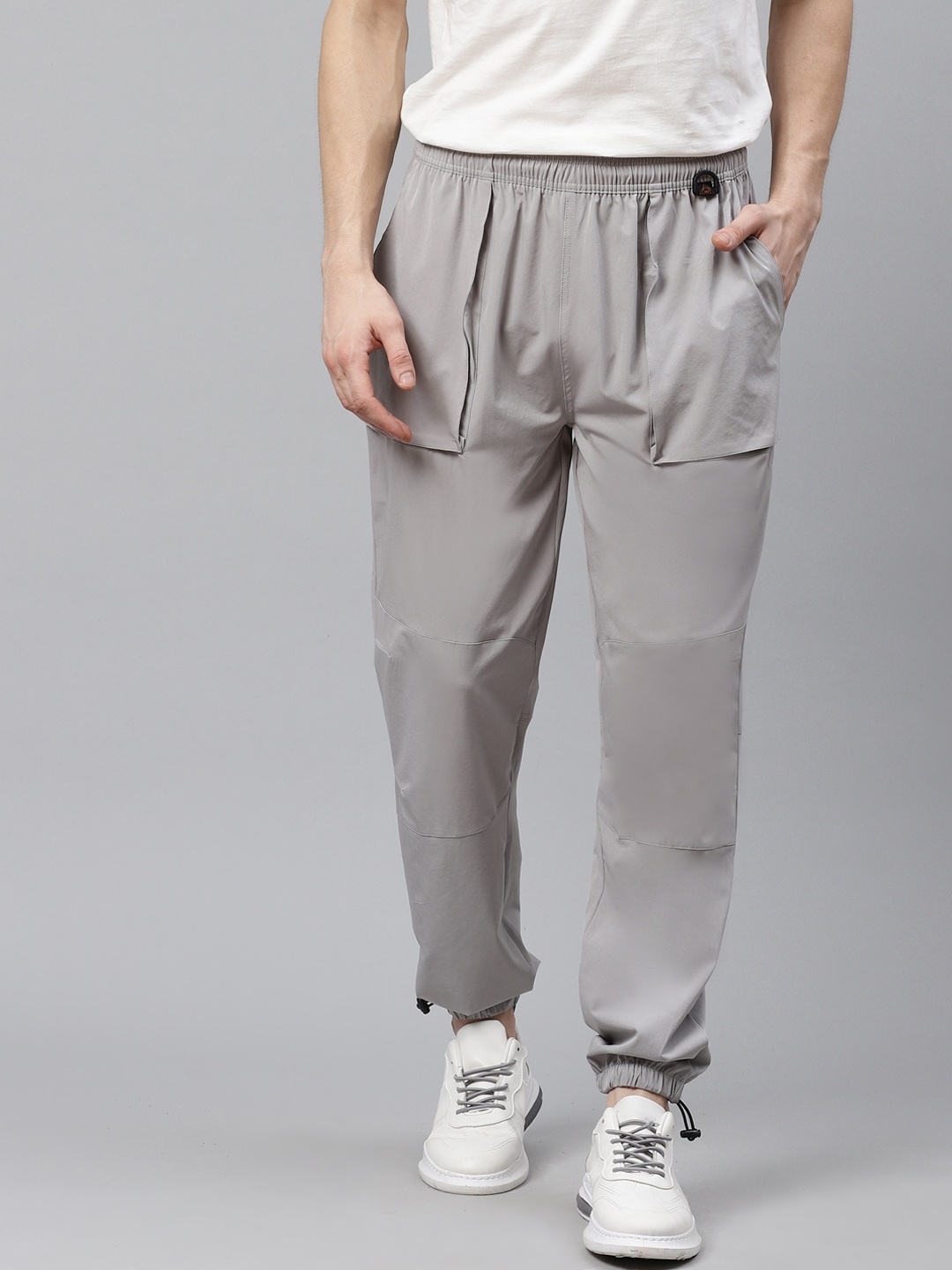 

HRX By Hrithik Roshan Men Wet Weather Solid Regular Fit Mid-Rise Rapid-Dry Outdoor Joggers, Grey