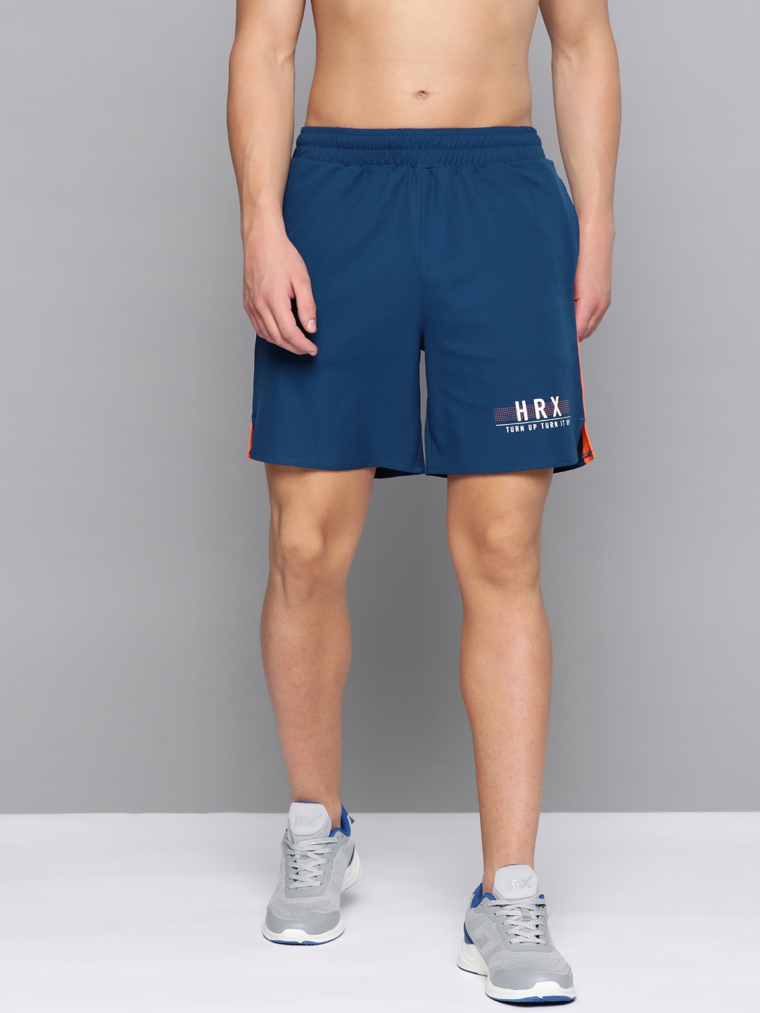 

HRX By Hrithik Roshan Men Estate Blue & Golden Poppy Colourblock Regular Fit Rapid-Dry Antimicrobial Running Shorts, Navy blue