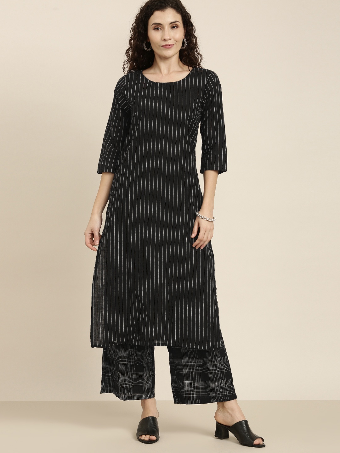 

Vishudh Women Black & Off-White Striped Kurta with Palazzos