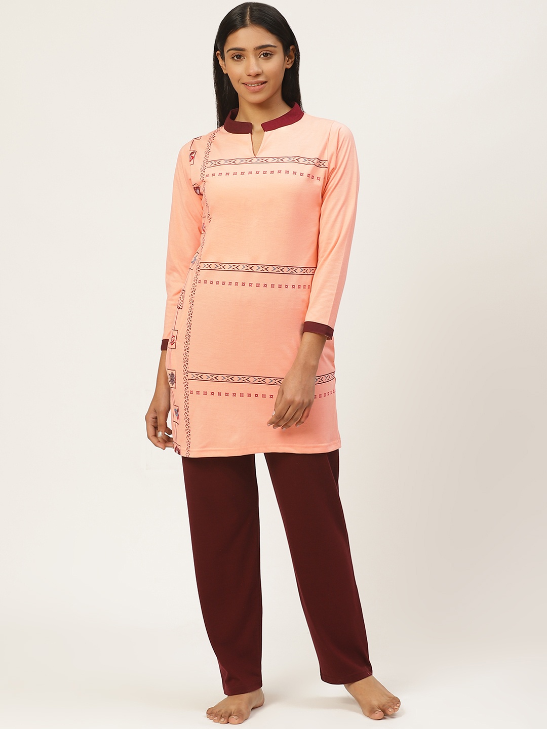 

Duchess Women Peach-Coloured & Burgundy Printed Night Suit