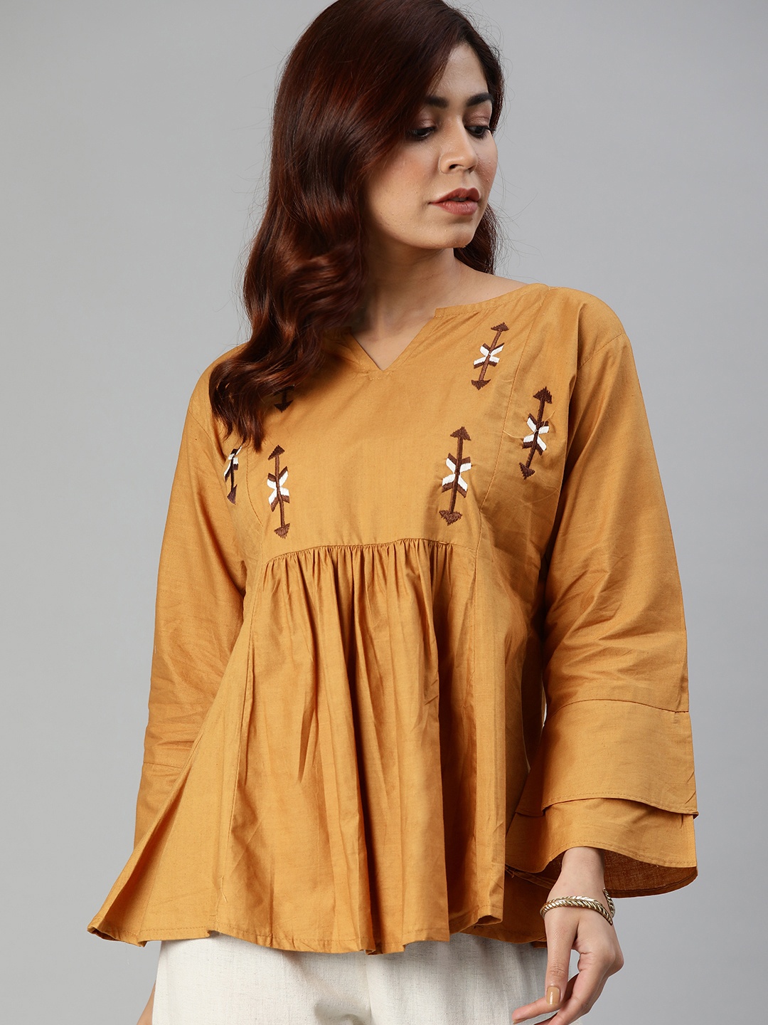 

Shavya Women Mustard Yellow Embroidered Tunic