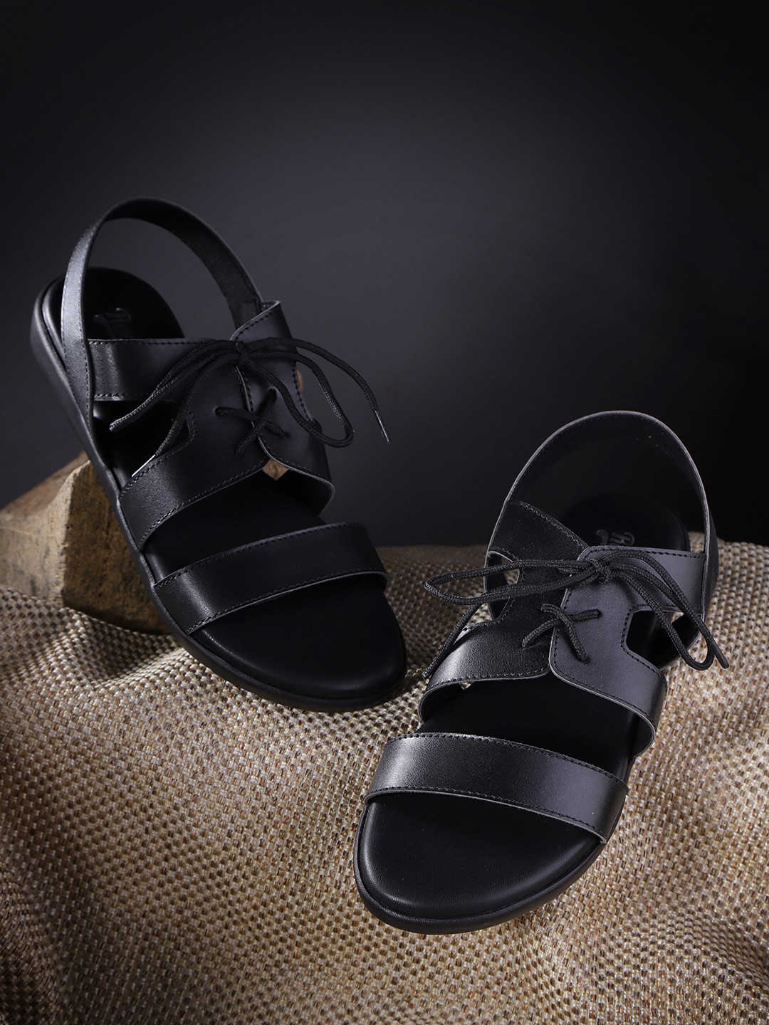

The Roadster Lifestyle Co Women Black Solid Open Toe Flats with Lace-Up Detail