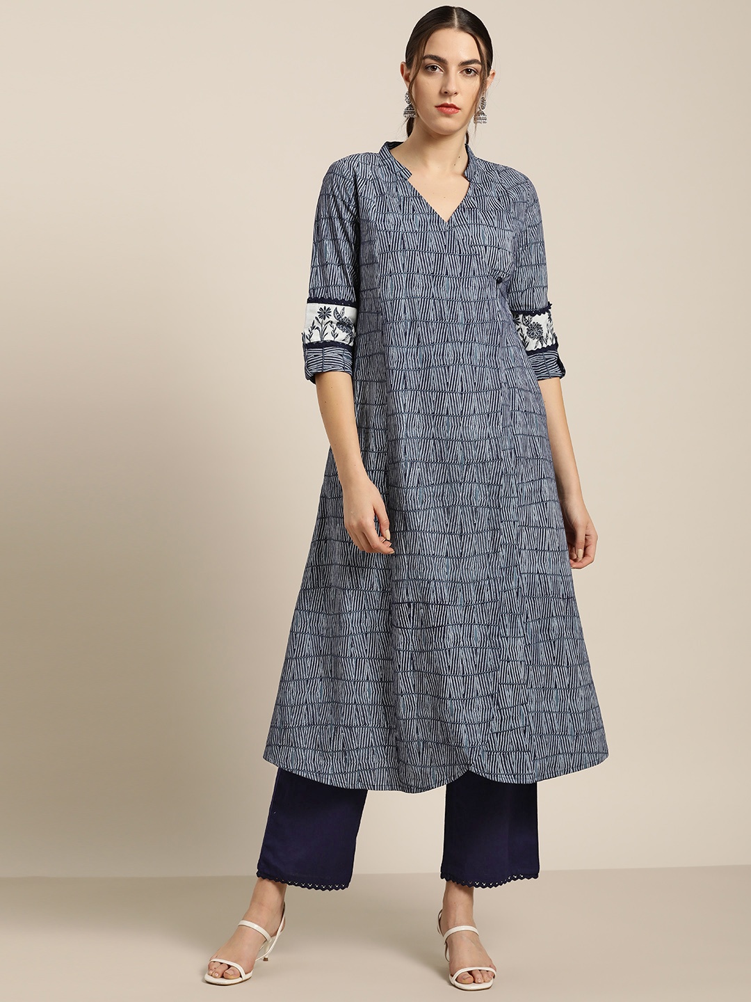 

Moda Rapido Women Navy Blue & Off-White Striped Kurta with Palazzos