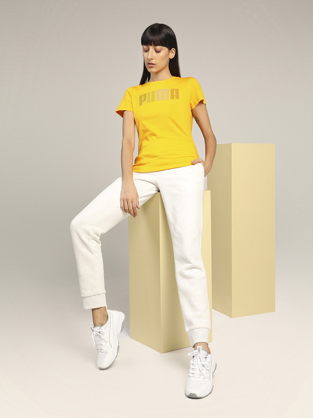 

Puma Women Yellow Solid Round Neck T-shirt