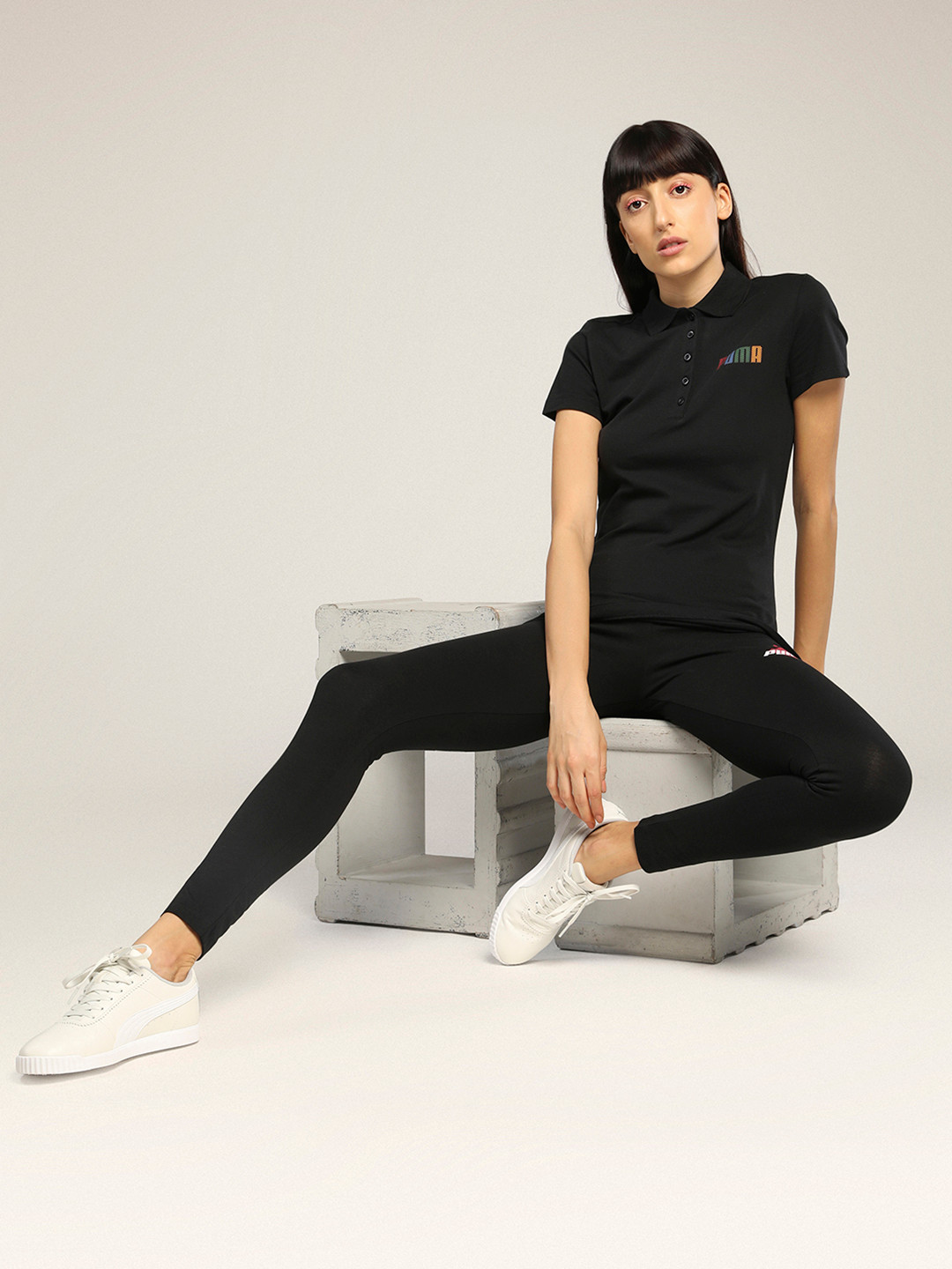 

Puma Women Black Solid Polo Collar T-shirt