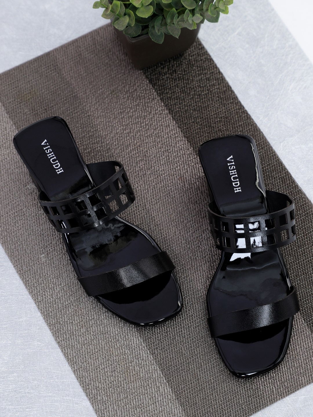 

Vishudh Women Black Solid Heels