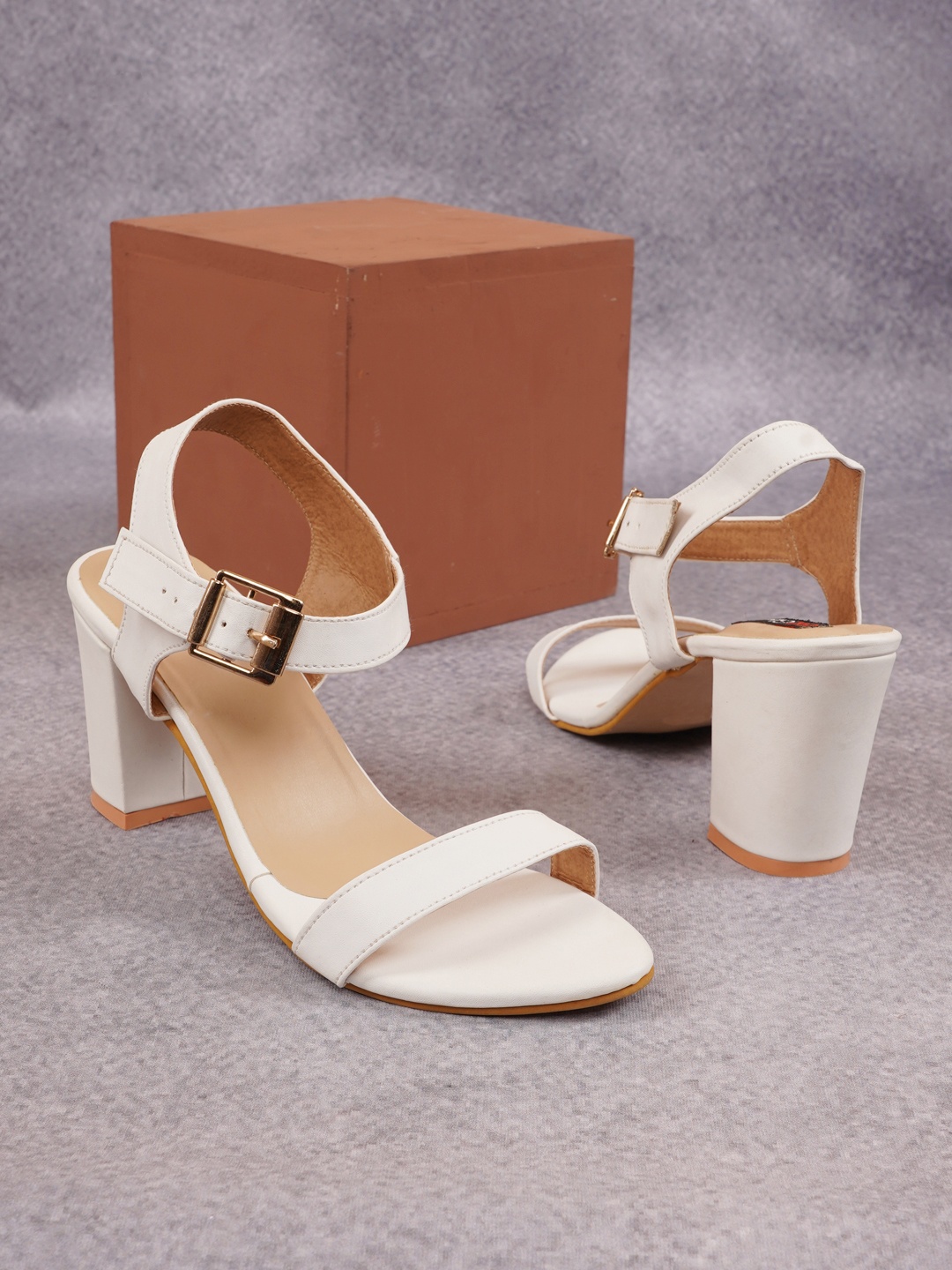 

Get Glamr Women White Solid Block Heels