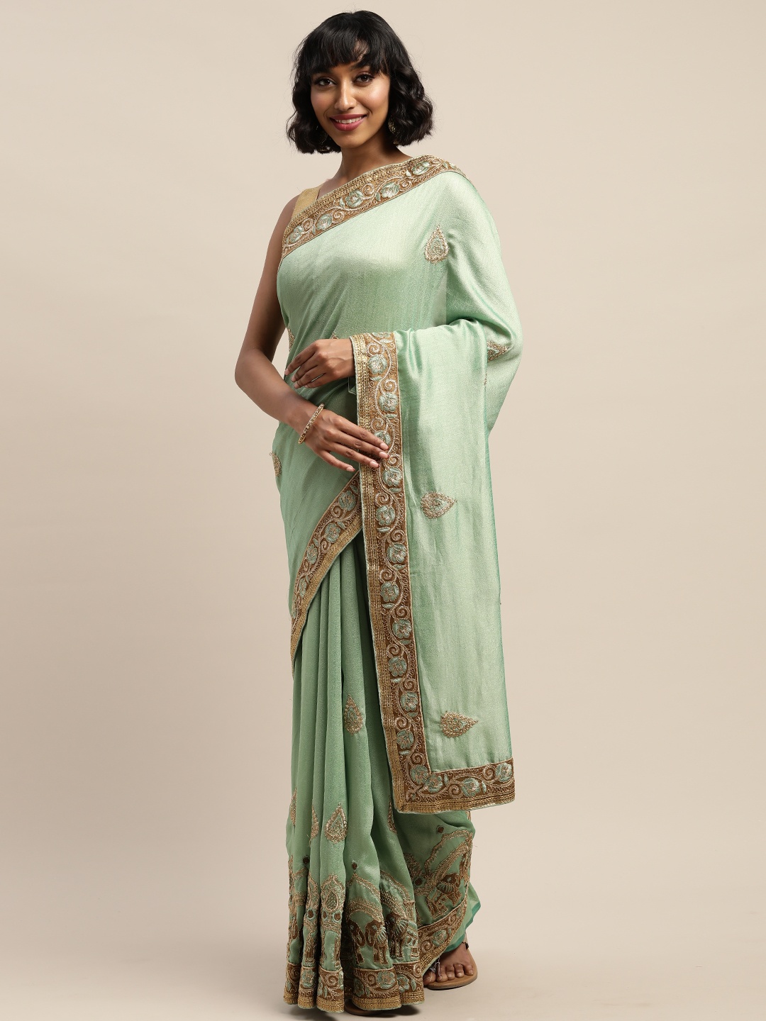 

Mitera Green Embroidered Silk Blend Saree