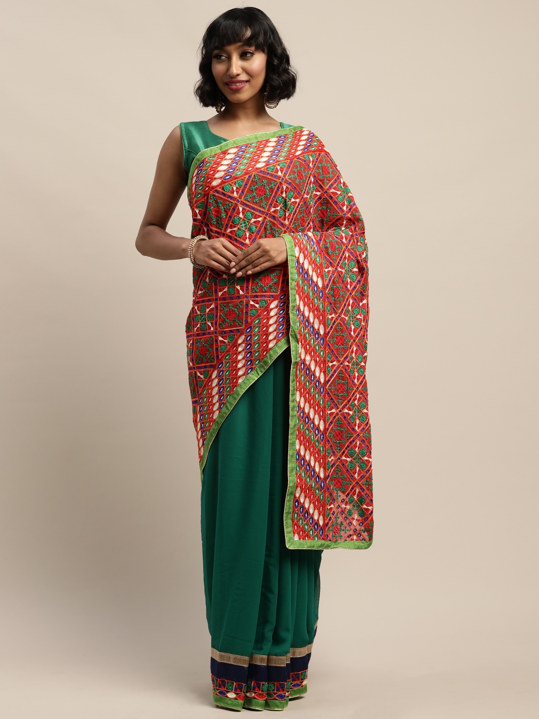 

Mitera Green Embroidered Pure Georgette Saree