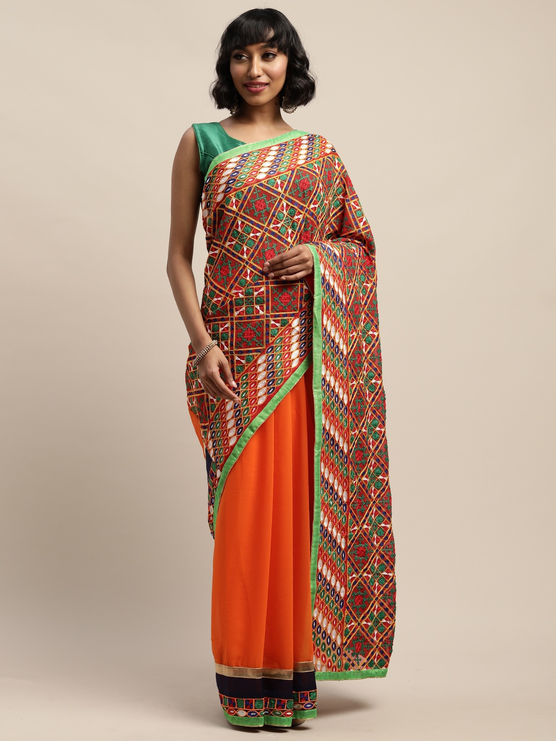 

Mitera Orange Embroidered Pure Georgette Saree