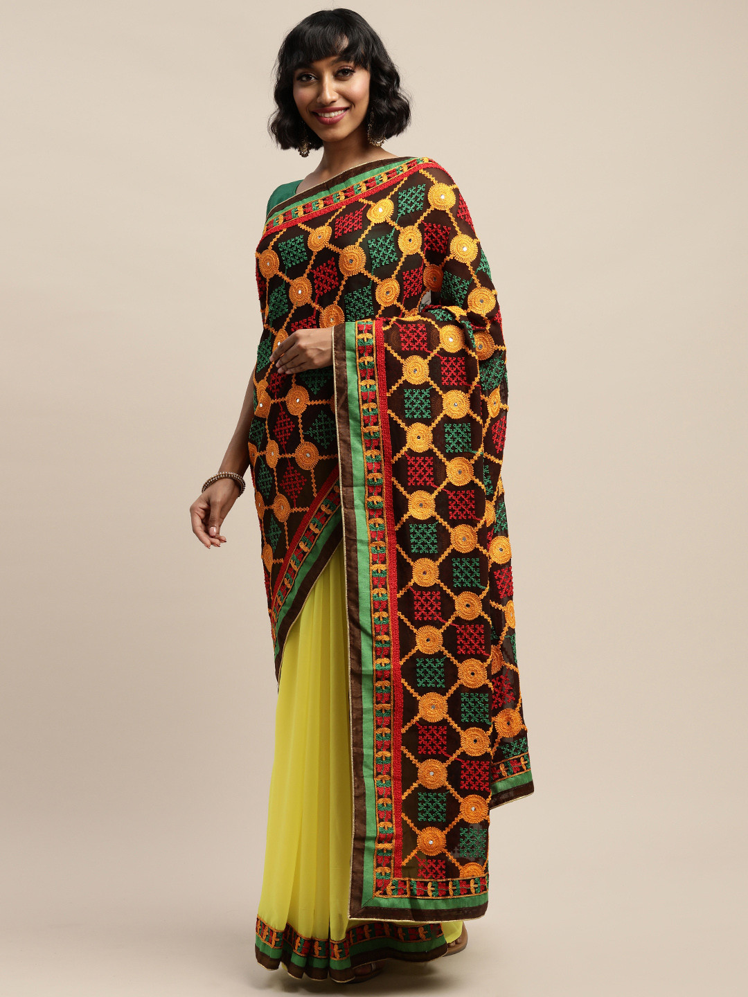 

Mitera Yellow Embroidered Pure Georgette Saree