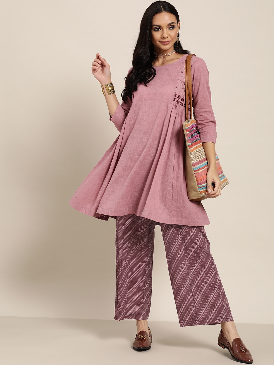 

Sangria Women Mauve Ethnic Motifs Embroidered Thread Work Pure Cotton Kurta with Palazzos