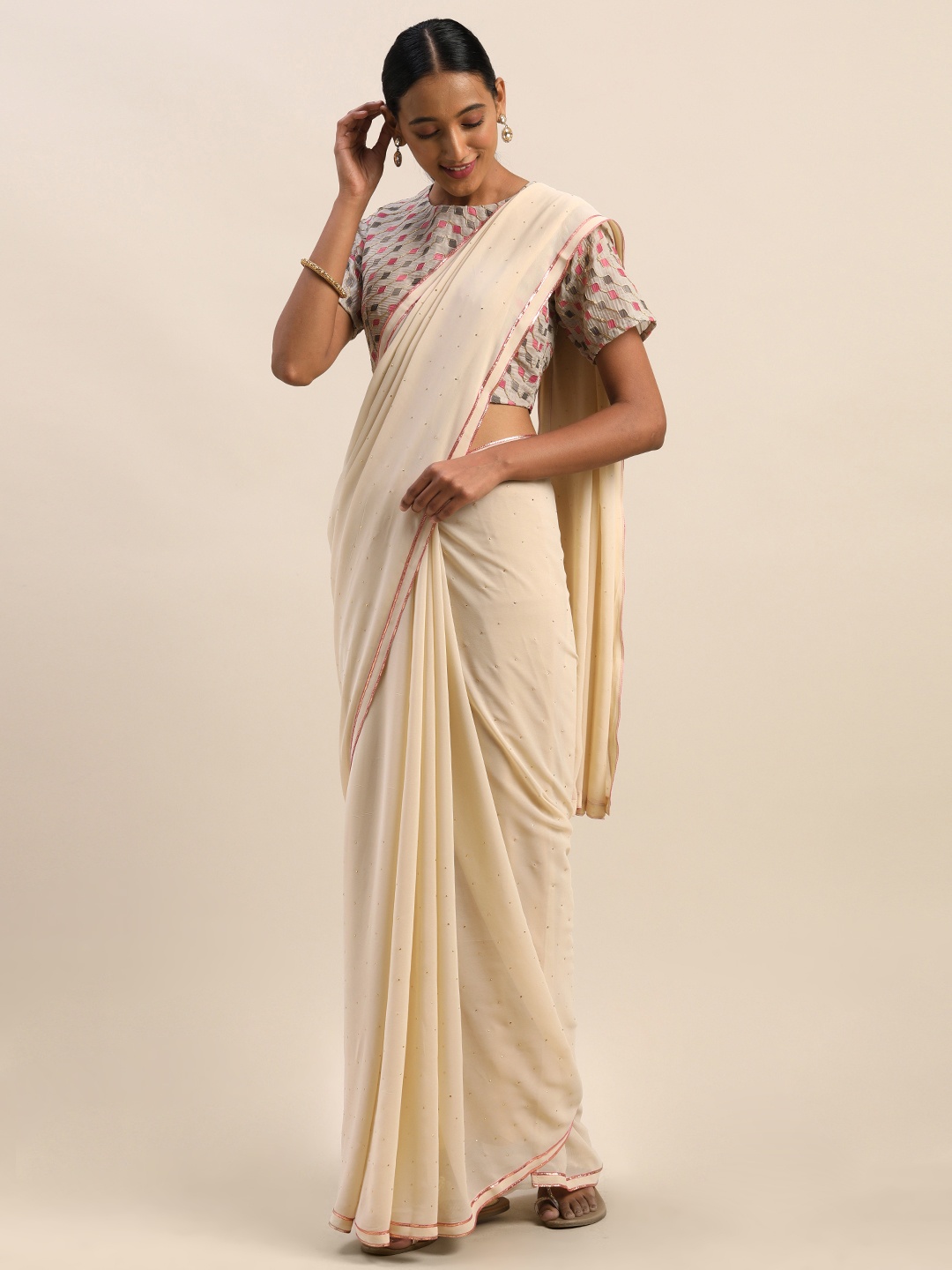 

Shaily Beige Embellished Saree
