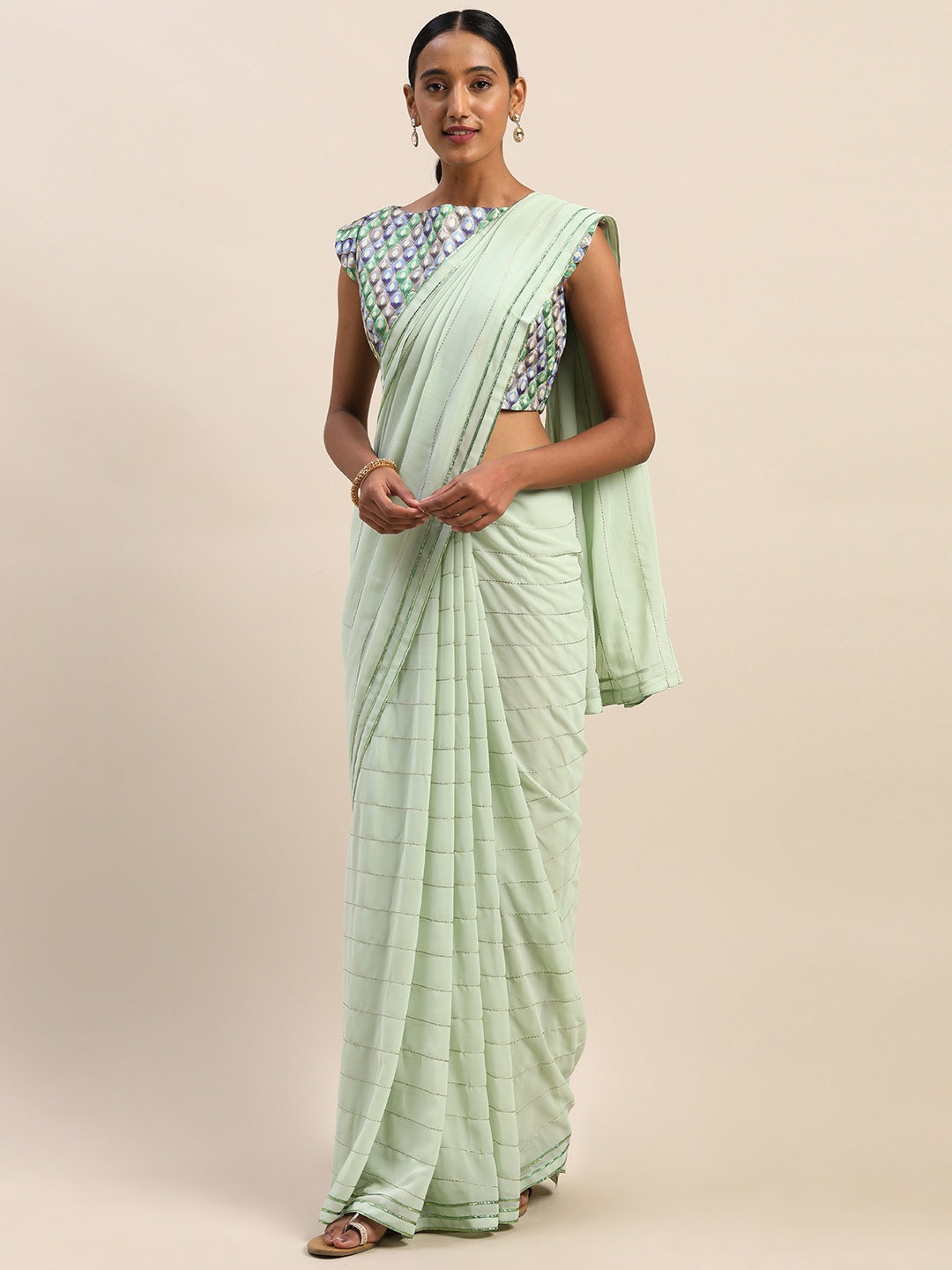 

Shaily Sea Green & Gold-Toned Striped Saree