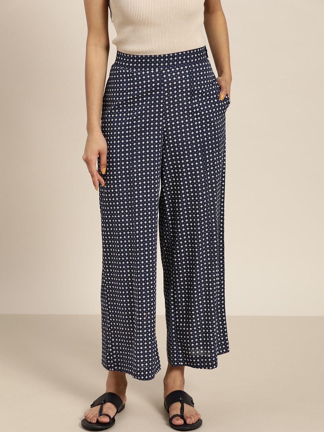 

Sangria Women Navy Blue & Off-White Pure Cotton Geometric Printed Wide Leg Palazzos