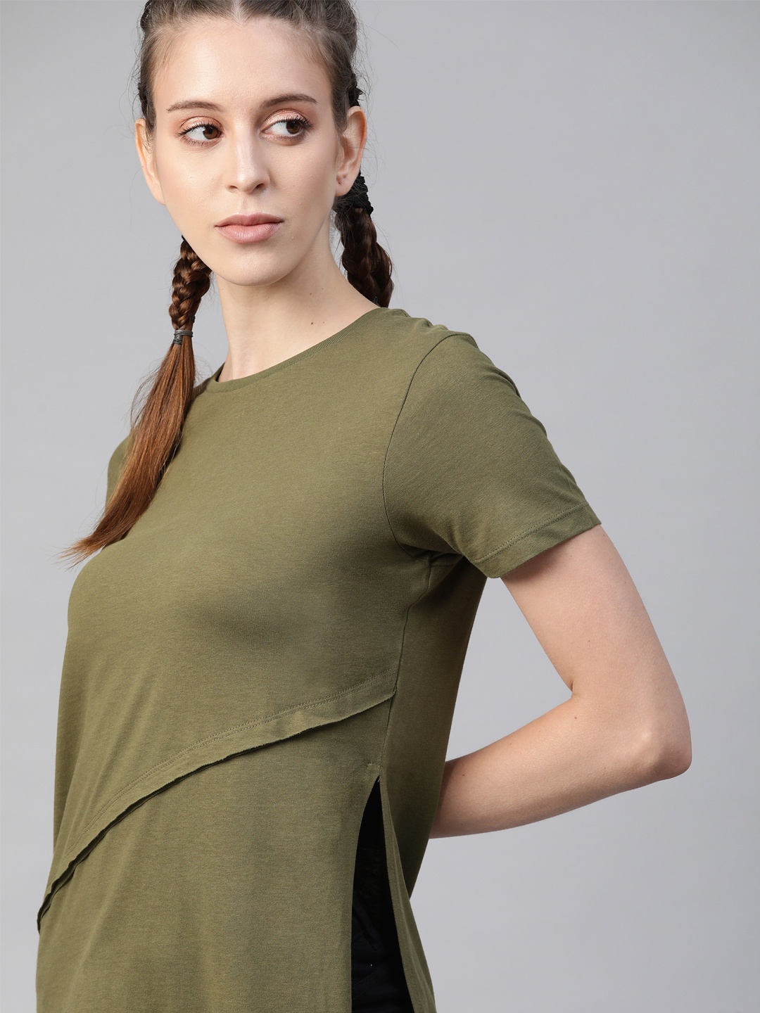 

The Roadster Lifestyle Co Olive Green Solid Cotton Layered High Slit Regular Top