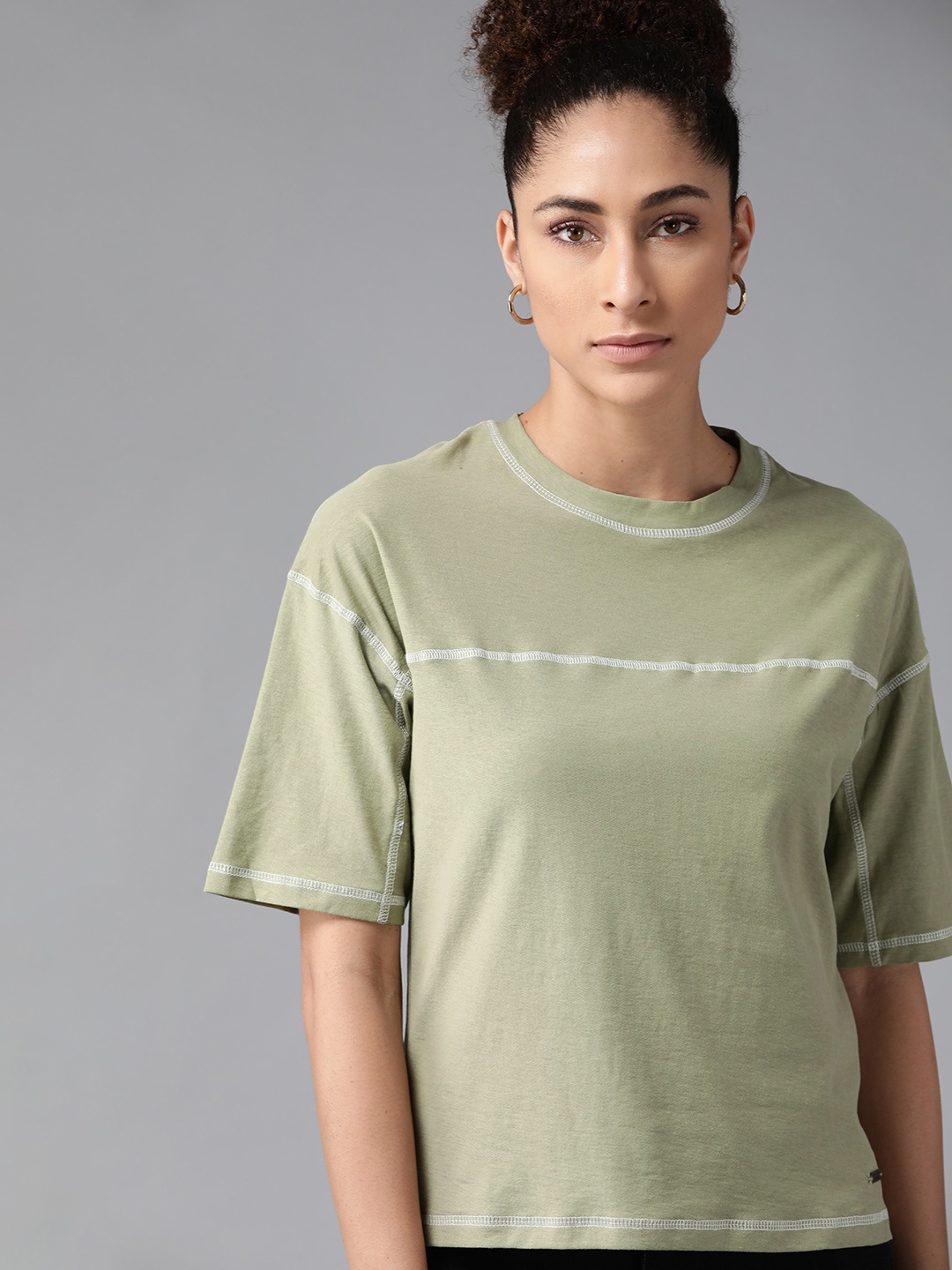 

The Roadster Lifestyle Co Women Green Solid Cotton Drop-Shoulder Sleeves T-shirt