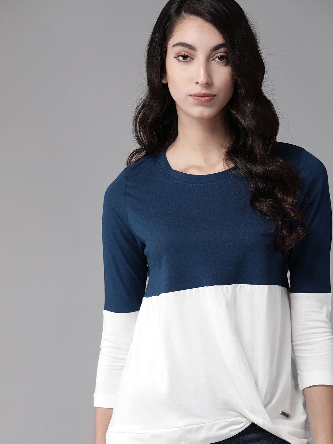 

The Roadster Lifestyle Co Navy Blue & White Colourblocked Twisted Regular Top