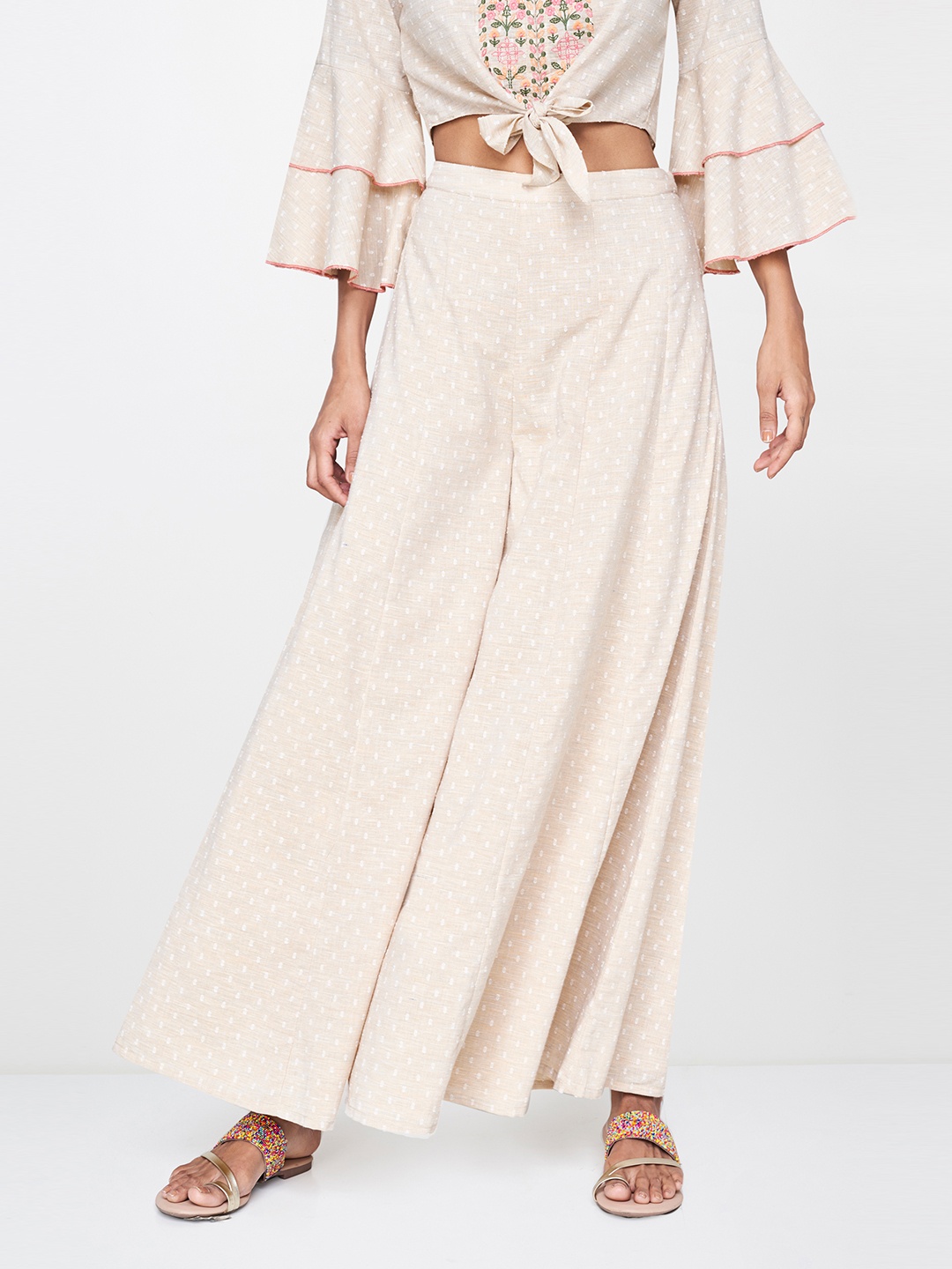 

Global Desi Women Beige Self Design Flared Palazzos