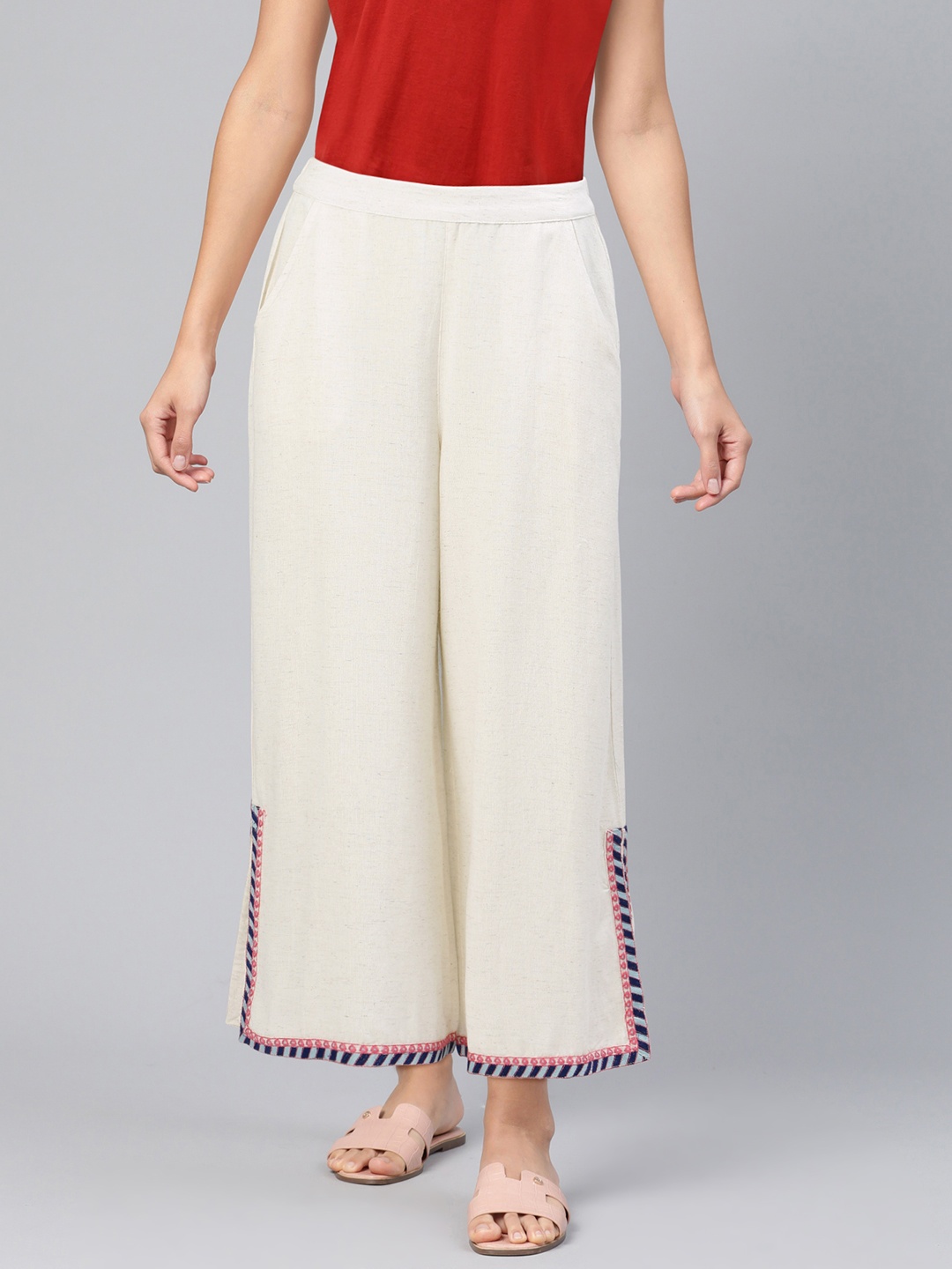 

Global Desi Women Off-White Solid Straight Palazzos