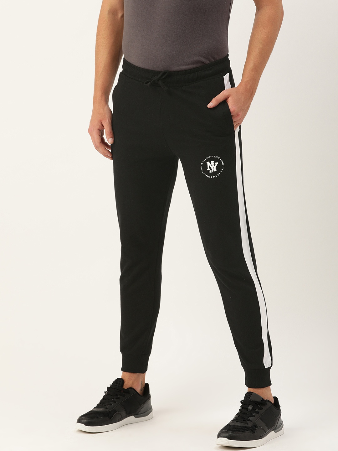 

The Indian Garage Co Men's Black Solid Track Pants with Side Stripes