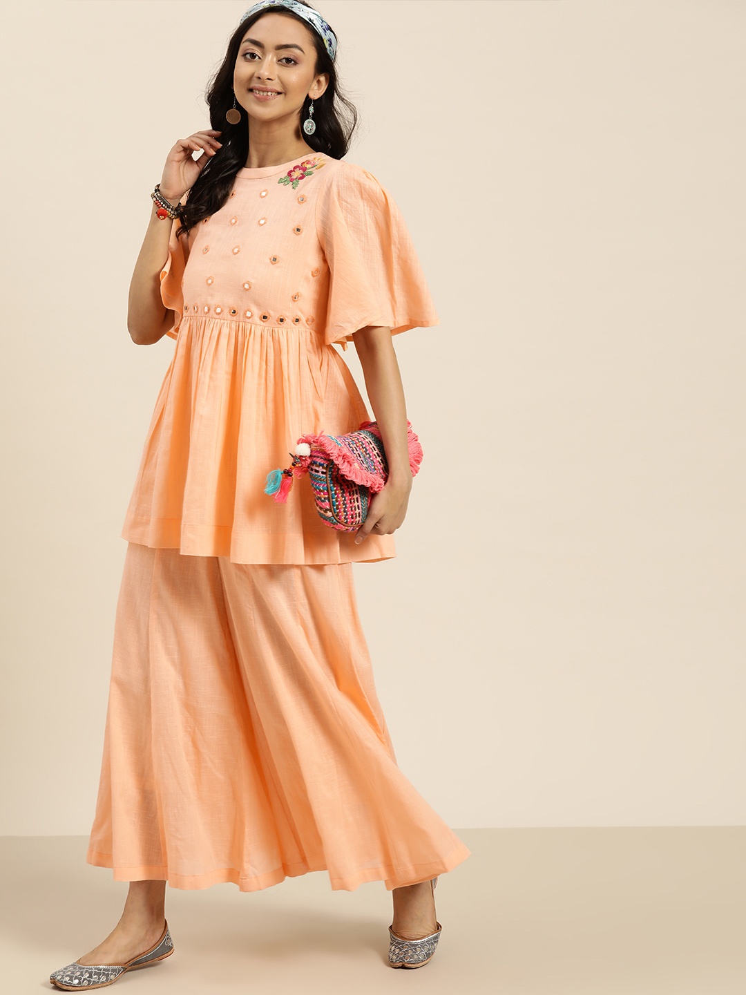 

Sangria Women Peach-Coloured Yoke Design Pleated A-Line Cotton Kurti with Palazzos
