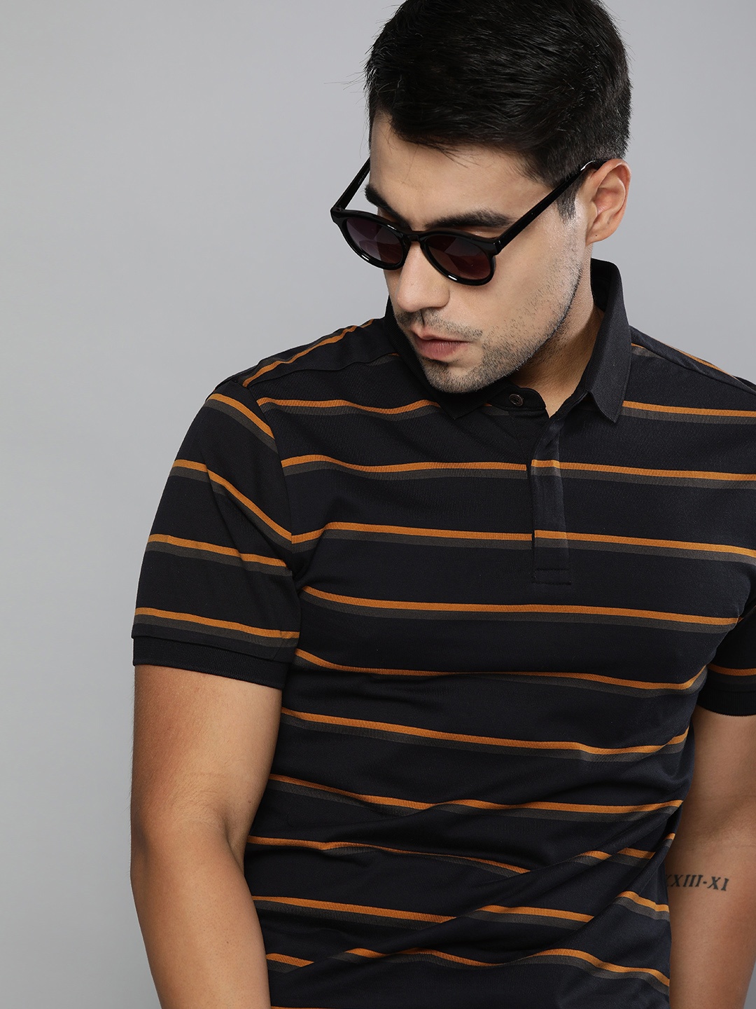 

Levis Men Black Orange Slim Fit Striped Polo Collar Pure Cotton T-shirt