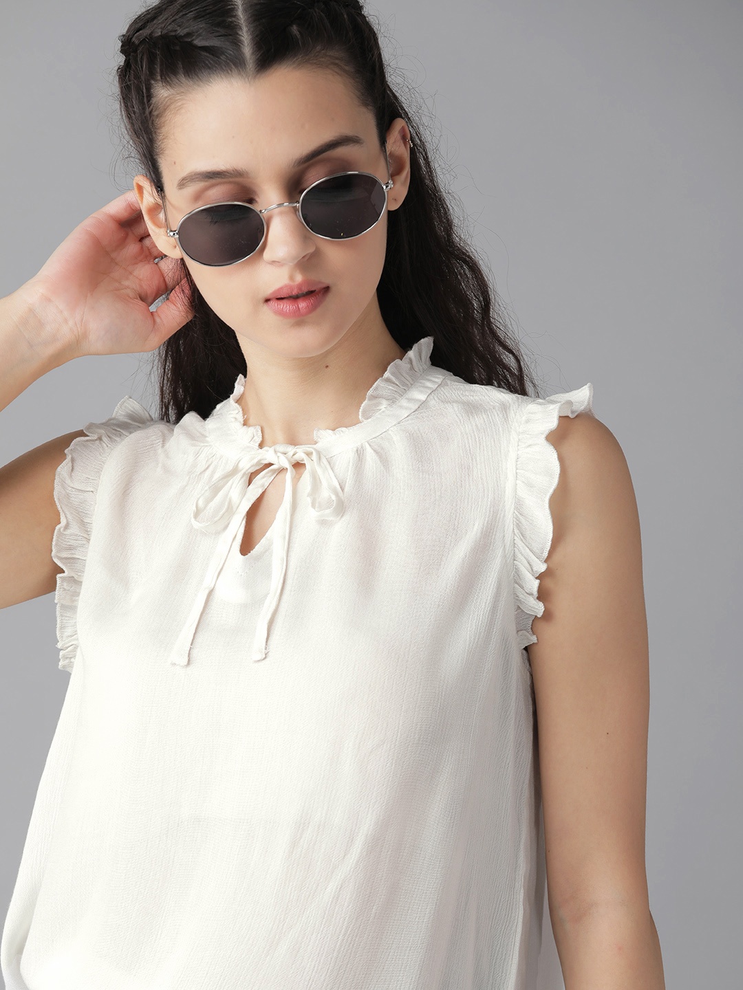 

The Roadster Lifestyle Co Women White Solid Tie-Up Neck Sleeveless Regular top