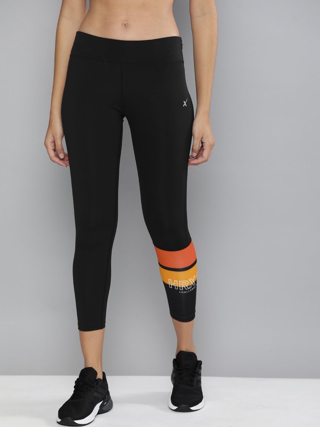 

HRX by Hrithik Roshan Women Black & Orange Printed Running Tights