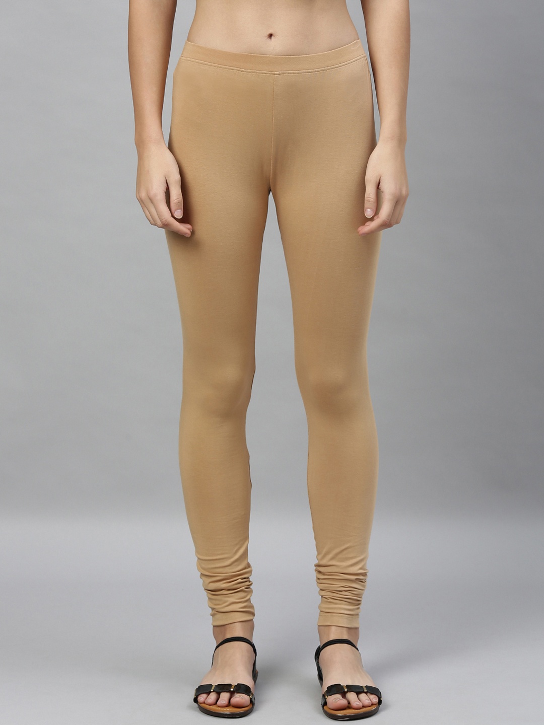 

Kryptic Women Beige Solid Churidar-Length Leggings