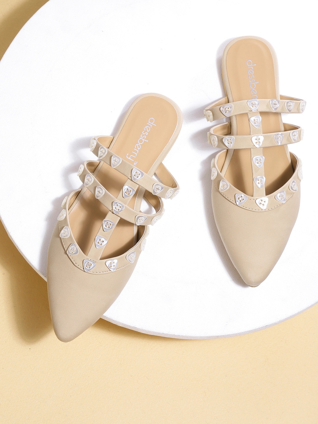 

DressBerry Women Beige Solid Flats with Button Detail
