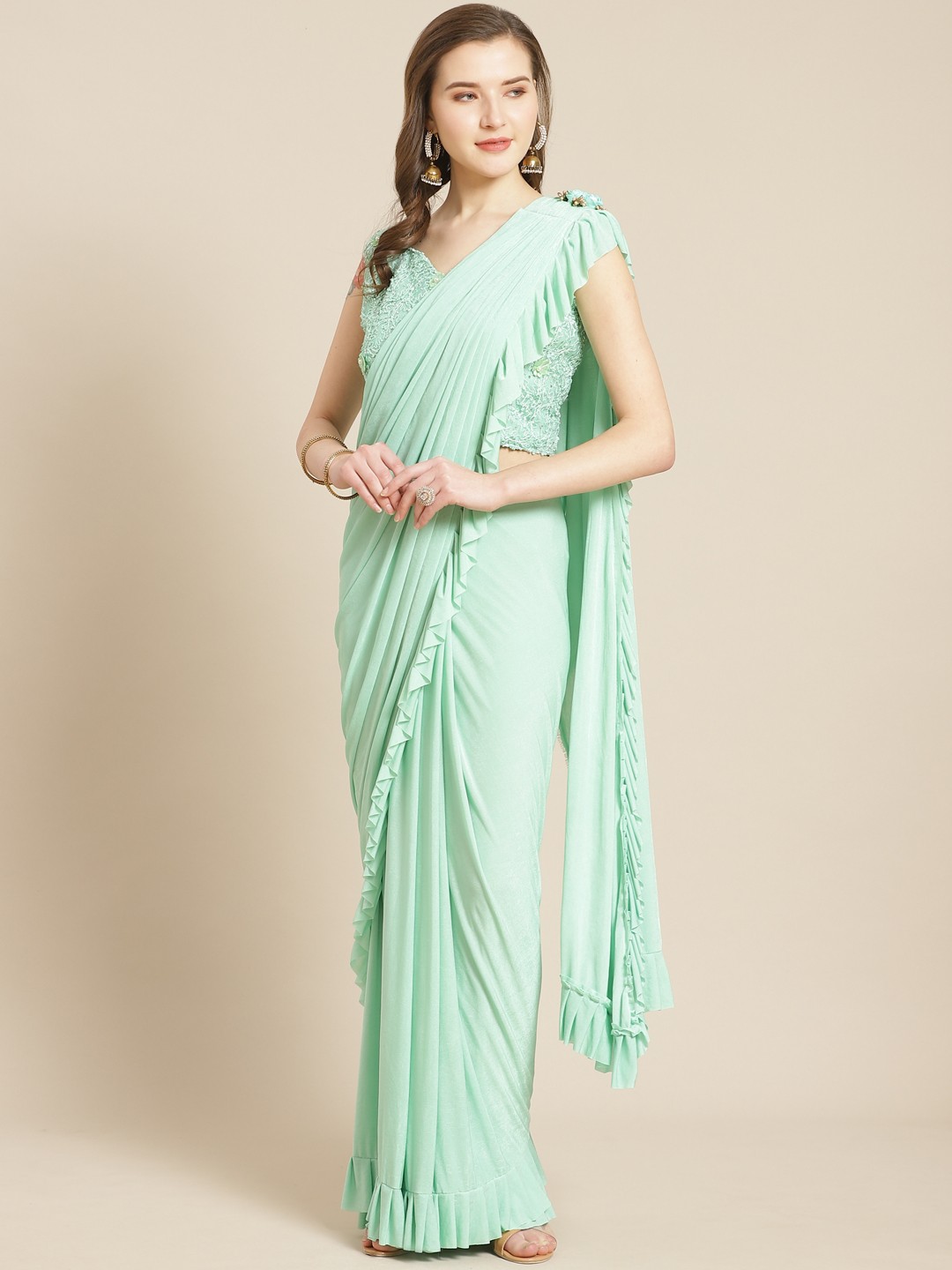 

Kalista Sea Green Solid Ruffle Ready to Wear Saree