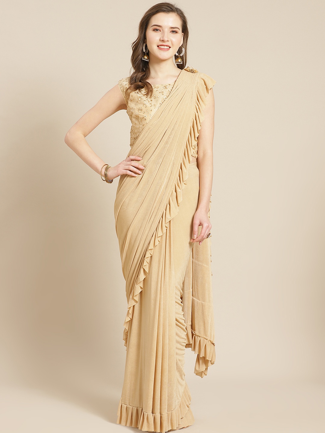 

Kalista Beige Solid Ruffle Ready to Wear Saree