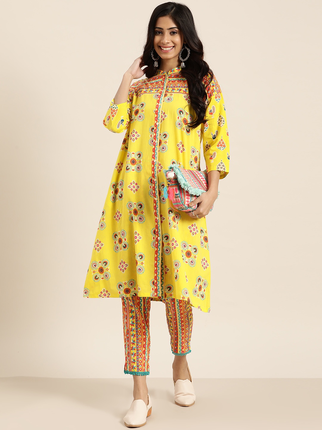 

Sangria Women Yellow & Orange Ethnic Motifs Printed Kurta with Trousers